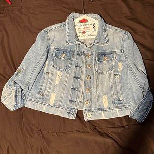Light blue ripped denim jacket